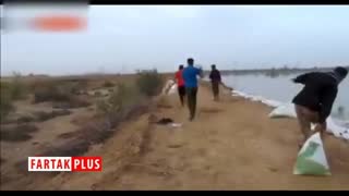 تلاش سه ساعته جوانان خوزستان برای ساخت سیل‌بند